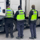 Officers searching a vehicle