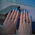 Woman's nails reading 'help me'