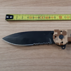 Seized lock knife against measuring tape