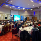Attendees listening to presenter at IAG conference
