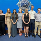 Nine interns lined up and posing for a photo