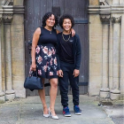 Kyron Hibbert stood in front of a door next to his mum