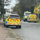 Several police cars parked along the street