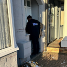 Police officer stood in a doorway
