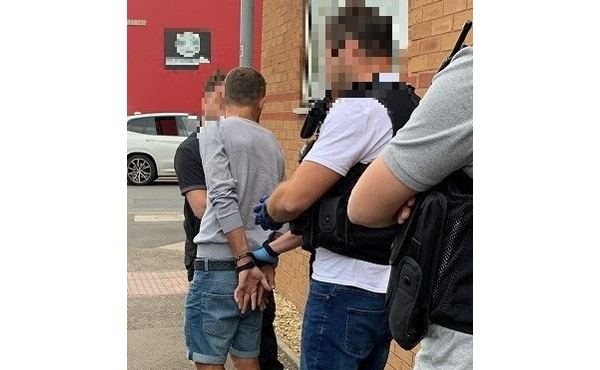 People being arrested in the street