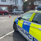 police car at the scene of a fatal stabbing in Luton