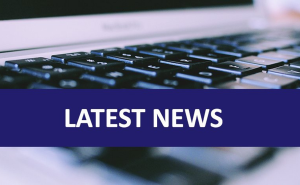 Laptop keyboard with Latest News written across the top