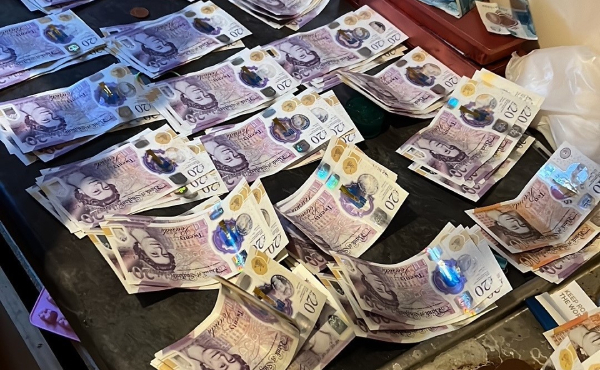 Piles of cash on a table