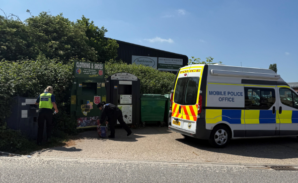 Officers checking knife bins